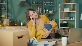 Mother Freelance Worker With Child From Home. Woman Tired Of Crying Baby. Stress Mother Concept. Upset Woman Have Headache. Businesswoman Tired with a Kid. Stressed Mom at Home Office - Powered by Shutterstock - Get 15% off with code: PIKWIZARD15