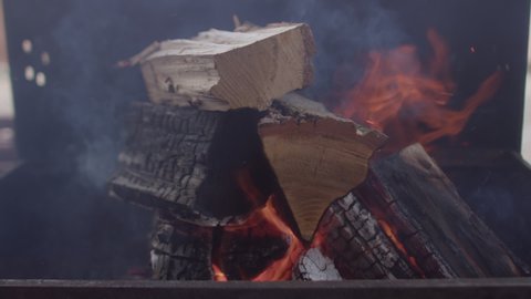 Firewood on fire. The biggest drawback and major environmental impact of wood burning is wood-smoke pollution. Sustainability of heating with wood.