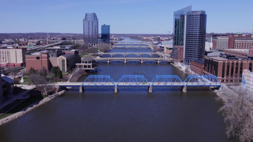 Forward aerial of Blue Bridge, Grand River and Grand Rapids skyline