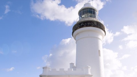 The beacon lamp of the Cape Byron lighthouse reflects the sunshine as it rotates on a beautiful sunny day.