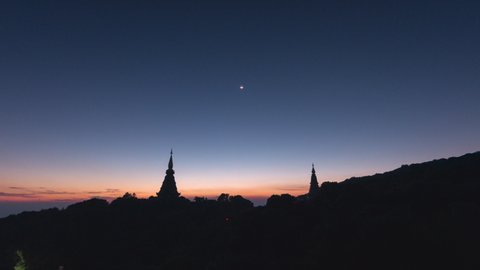 Time Lapse 4K of Twilight Moments sunset or sunrise Above the sacred pagoda at Doi Inthanon National Park, Chiang Mai, Thailand.