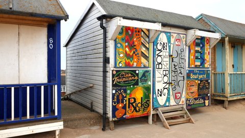 Sutton-on-sea , United Kingdom (UK) - 05 04 2022: Surfer retro beach hut with surfing grafitti on front of the shack