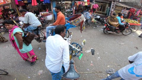 POV of cycle rickshaw rider at the street of Bettiah, Bihar, India, 10 December 2021