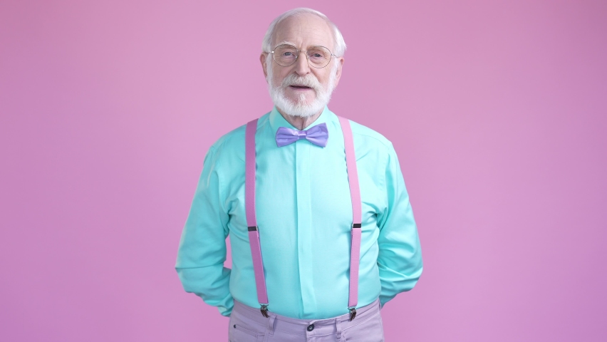 Aged man give woman day package isolated pastel color background Royalty-Free Stock Footage #1089947695