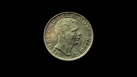 Rotating obverse of Romania coin 200 lei 1942 with inscription meaning MIHAI I THE KING OF ROMANIANS. Isolated in black background.