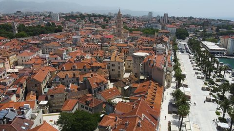 Tourists Visit The Saint Domnius Cathedral And Vestibul In Diocletian's Palace, Split, Croatia. - aerial tilt down