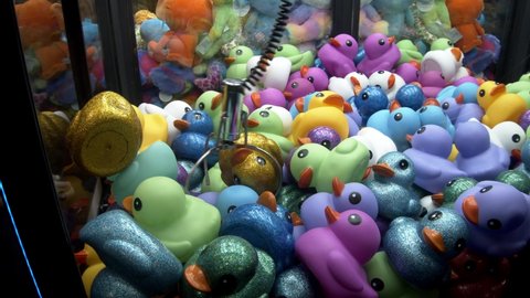 Arcade Claw Machine Winning A Rubber Duck Prize