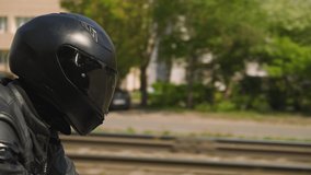 Happy couple in protective helmets rides contemporary motorcycle spending time together along city street on sunny day slow motion closeup - Powered by Shutterstock - Get 15% off with code: PIKWIZARD15