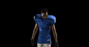 Animation of african american male american football player with helmet over shapes. global sport and digital interface concept digitally generated video.