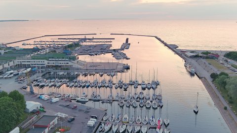 Tallinn.Estonia-July 5.2021: Amazing drone shot of the harbor for sailboats in Tallinn Estonia. Awesome view of the sea and the boats. Camera slowly moving forward while tilting downwards.