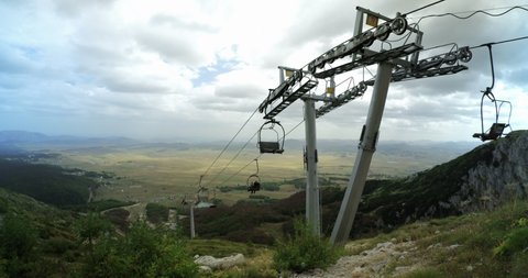 ZABLJAK, MONTENEGRO - SEPTEMBER 16, 2021: Ultra-wide view on ski lift on Savin Kuk mountain top in Durmitor National Park, Montenegro. DCI 4K, Editorial