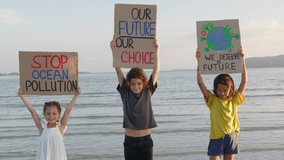 Three staying on the seaside at sunset light against the backdrop of the island. They are striking about Environmental Issues, Ecological problems such as ocean pollution with plastics.  - Powered by Shutterstock - Get 15% off with code: PIKWIZARD15