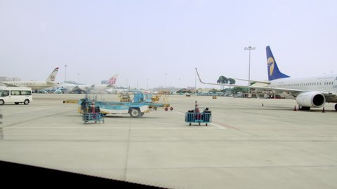 A view of parked planes taken shot from inside an airport bus that takes people to the planes after checking in for a flight at Ho Chi Minh Airport, Asia, Saigon, Vietnam, April 10, 2022.