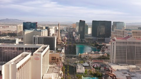 Aerial day video of Las Vegas Strip, Paris with Eiffel tower, Cosmopolitan, Bellagio luxury resorts and casinos. Busy street traffic and modern design hotel buildings, Las Vegas, Nevada USA April 2022