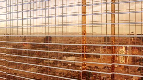 Las Vegas, USA. Shiny Trump hotel golden glass skyscraper building aerial on sunny day. Epic city reflection in cinematic bronze gold glass of modern design architecture business office. Apr 2022