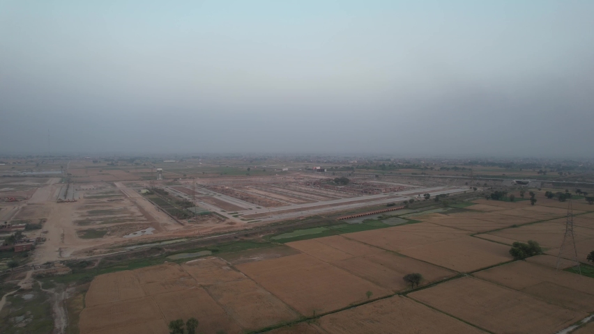 Beautiful Sunrise over Lahore Smart City and Motorways at Kala Shah Kako Village Punjab Pakistan, Drone