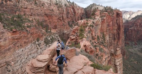 Springdale, Utah, USA - March 31, 2022: People hike down from Angels Landing, a popular and dangerous hike in Zion National Park. A limited entry system was implemented one day later.