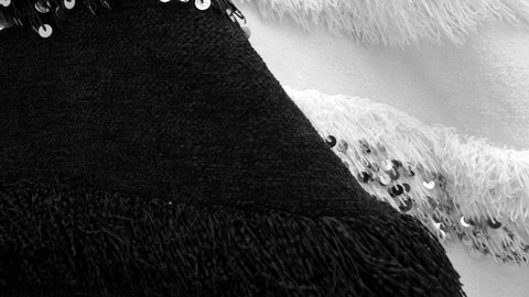 Traditional Moroccan black and white wool fabric, blanket with silver paillettes, sequin. Can be used as throw or bedcover. 4k footage.
