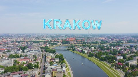 Inscription on video. Krakow, Poland. Wawel Castle. Ships on the Vistula River. View of the historic center. Arises from blue water, Aerial View
