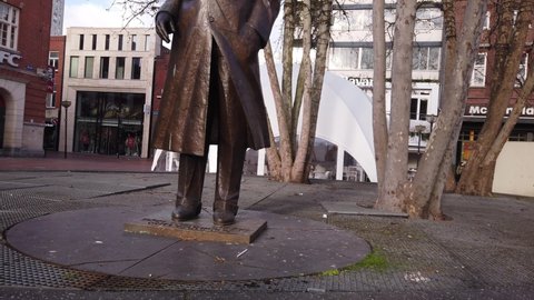 Eindhoven, Netherlands, January 29, 2022: TILT Monument to Frederik Jacques "Frits" Philips by Kees Verkade. The Frits Philips bronze Statue is located in the Market Place in the center of Eindhoven.