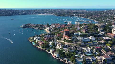 Aerial drone view of harbour side suburb of Point Piper in East Sydney, NSW, Australia heading toward Rose Bay in the background on a sunny day 
