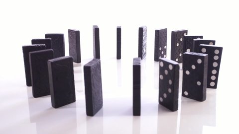 Black wooden Domino Stones turn around isolated on white Background