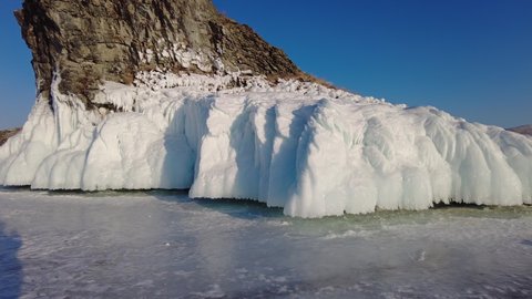 Around view of frozen Lake Baikal, Olkhon Island, Rock cape. Siberia, Russia, 4k