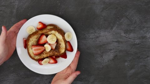 Serving French Toast with Strawberries and Bananas