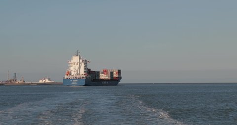 Rotterdam, The Netherlands - Circa 2019: Container ship sailing in the Port of Rotterdam, near Maasvlakte. Cargo vessel heading at to the North Sea