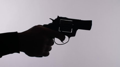 A silhouette of hand shooting a gun