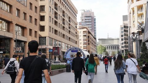 Yerevan, Armenia - April 28, 2022 : city street with a lot of people walking on foot without cars. With a view of the Yerevan Opera House.