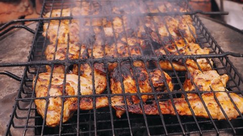 marinated meat is grilled over charcoal grill. Medium plan