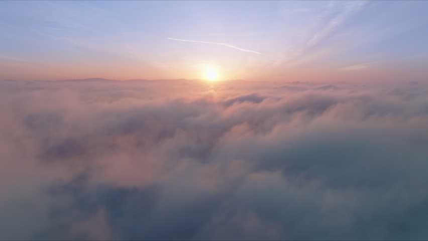 4K aerial majestic sunrise above amazing cloudscape with sun light heavenly shining through golden clouds. Paradise clouds slow motion at pink sunset. Nature environment background, heavens footage Royalty-Free Stock Footage #1090024497