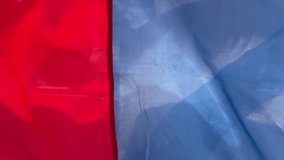 Vertical 4K video. Striped white, red, blue flag of Russian Federation flutters in the wind. Independence Day of Russia. Concept of patriotism, love for motherland and fatherland. State symbol. Nation