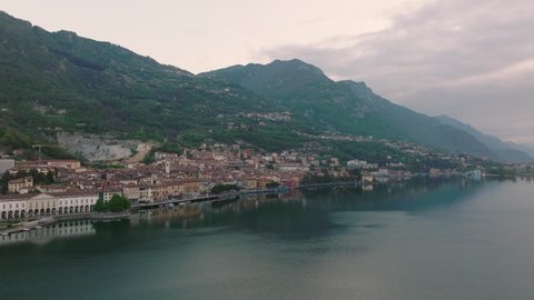 Aeriel view of Lake Iseo at sunrise, on the left the city of lovere which runs along the lake,Bergamo Italy.
