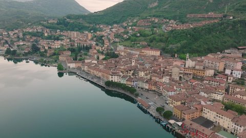 Aeriel view of Lake Iseo at sunrise, on the right the city of lovere which runs along the lake,Bergamo Italy.