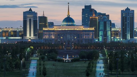 Close up view of Astana city day to night transition timelapse and the president's residence Akorda with park. View from the Palace of Peace and Reconciliation. Nur-Sultan city, Kazakhstan