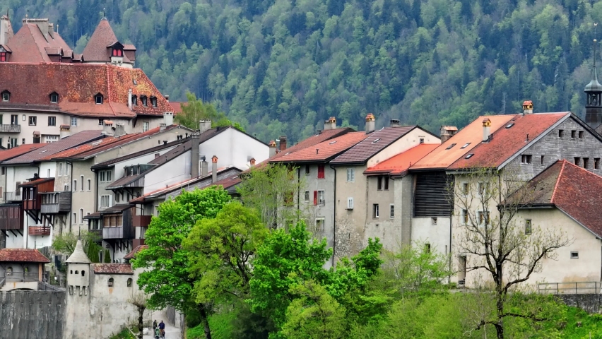 tele shot of Gruyere castle in Switzerland, medieval Swiss historical fortress, a famous tourist destination in Switzerland, a village of Gruyere in the Swiss Alps. High quality 4k footage