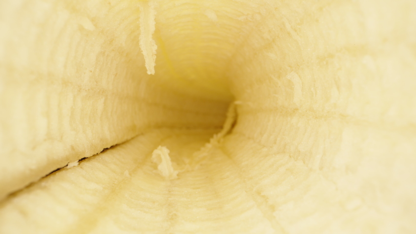 Banana peel inside. Dolly slider extreme close-up inside. Laowa Probe Royalty-Free Stock Footage #1090041225
