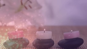 Animation of light spots over candles and flower. national relaxation day and celebration concept digitally generated video.