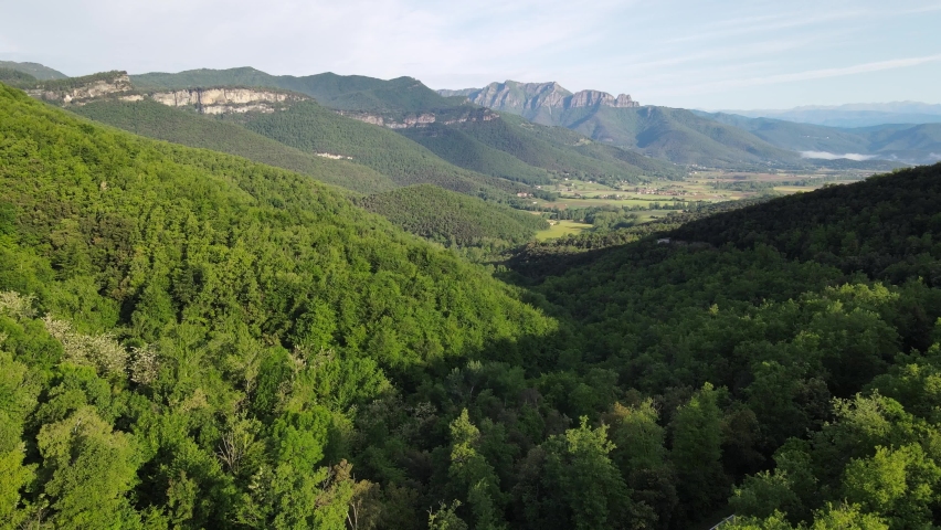 Aerial scene with drone of the spring landscape in La Vall D En Bas, La Garrotxa, Girona, Spain. 4K UHD
 Royalty-Free Stock Footage #1090044439