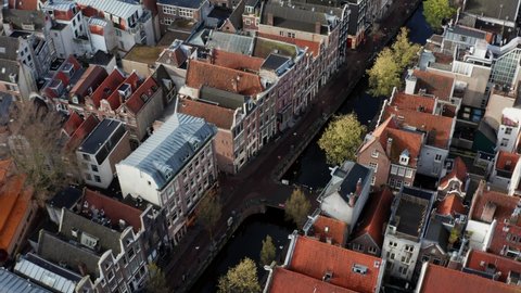 Aerial top shot of Amsterdam Red light district Canals, Netherlands sunny morning 4K