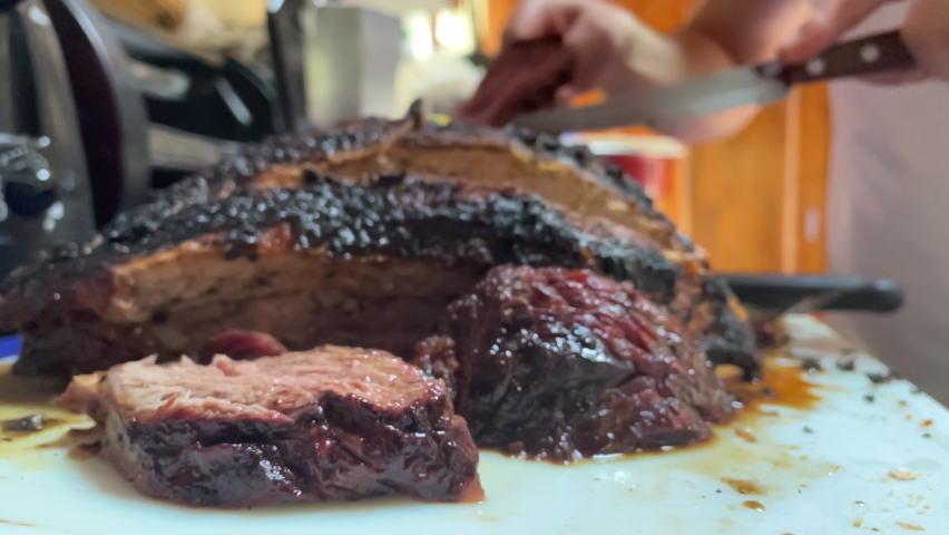 slow motion scene of freshly cut roast beef ready to be served