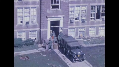CIRCA 1974 - Soldiers load boxes onto a truck from a building heavily damaged by a tornado in Xenia, Ohio.