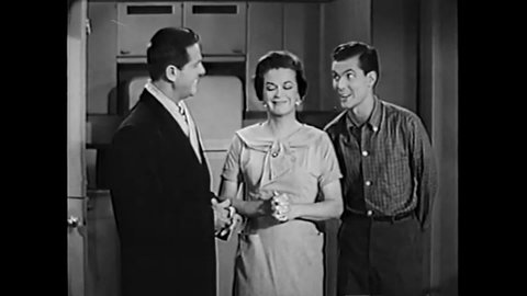 CIRCA 1958 - In this sitcom episode, a photographer tries to tell his family he's working late but they know it's a date.