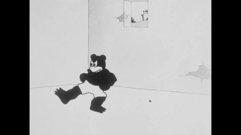 CIRCA 1925 - In this animated film, a weak cat is scared to box a strong bear.