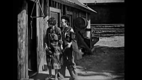 CIRCA 1925 - In this silent comedy, a man defeats his romantic rival by trapping him in a table with a sliding partition.