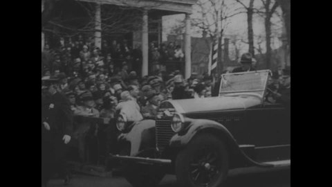 CIRCA 1920s - Troops in dress uniforms pass for review by President Coolidge and Governor Byrd in Alexandria.