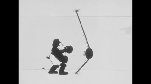 CIRCA 1925 - In this animated film, animals cheer for a bear as he boxes a punching bag.