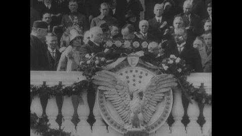 CIRCA 1923 - Crowds cheer President Coolidge during his speech on inauguration day.